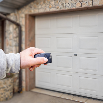 Des Moines security key fob pointing to a garage door